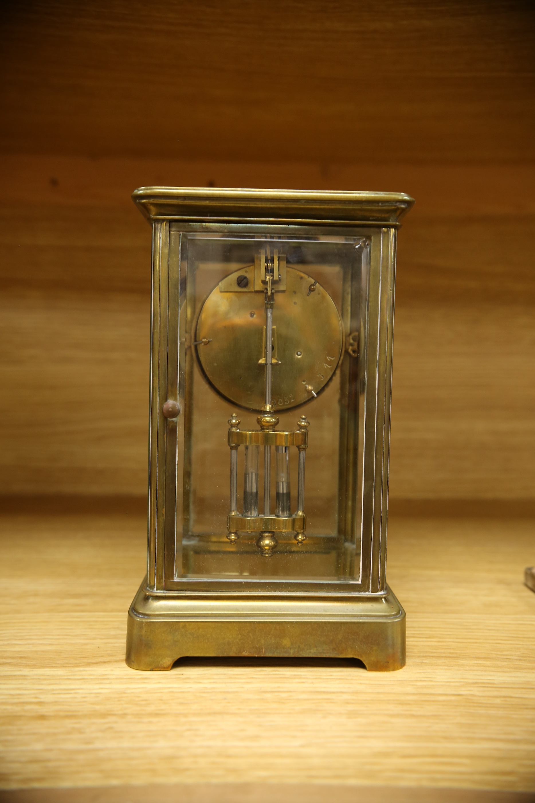 An early 20th century brass four glass mantel clock, 22cm. Condition - fair, not tested as working